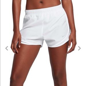 White Nike running shorts